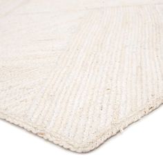 a white rug is shown on a white surface with no one in it or someone else