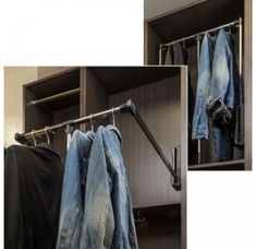 an open closet with jeans hanging on clothes rails