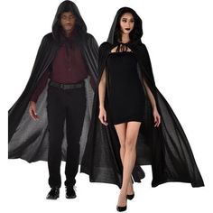 two people dressed in black and one wearing a cape