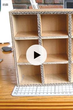 an open bookcase sitting on top of a wooden table