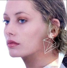 These geometrical earrings are made of multiple triangles to form a large diamond shape design.  You will be surprised how lightweight they are. Eye-catching and elegant to wear.  They add something extra to any outfit, while still keeping it simple and stylish. Length - 6.5 cm Width - 4,5 cm There is a gold plated version for those who prefer them in gold. Triangle Silver Jewelry For Party, Silver Triangle Earrings For Party, Silver Triangle Party Earrings, Minimalist Geometric Earrings For Party, Trendy Geometric Earrings For Party, Modern Triangle Earrings For Party, Modern Triangle Party Earrings, Chic Geometric Earrings For Party, Modern Geometric Earrings For Party