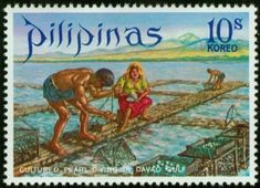 a stamp with an image of two people on a dock