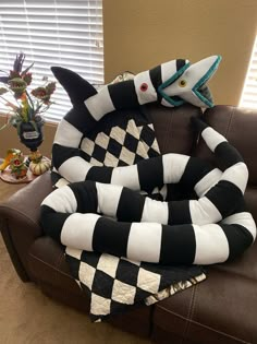 a stuffed animal sitting on top of a couch