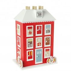 a red and white toy house with numbers on it