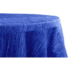 a blue table cloth on top of a round table with pleated edges and a white background