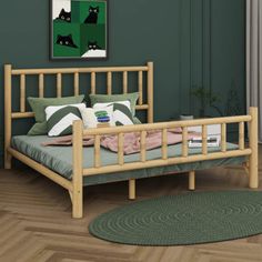 a wooden bed frame in a green room with wood floors and rugs on the floor