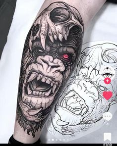 a man's arm with a tattoo on it and an image of a demon