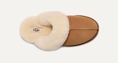 UGG™ Scuffette II Chestnut Women's House Slipper Our essential house slipper is cast in soft suede and our signature sheepskin. It's like therapy for your feet. This product was made in a factory that supports women in our supply chain with the help of HERproject. This collaborative initiative creates partnerships with brands like ours to empower and educate women in the workplace. Suede upper Sheepskin collar 17mm sheepskin lining 17mm sheepskin insole Molded rubber outsole Polyester binding or Cozy Indoor Suede Slippers, Cozy Brown Sheepskin Slippers, Women In The Workplace, Boot Jewelry, Work Boots Men, Woven Labels, House Slippers, Real Fur, Women Supporting Women