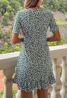 The Emes Shop dress is detailed with a feminine ruffle hem detail. Features a floral print. surplice neck. short sleeves. and above knee length. Pair it with clear heels and sunnies for an easygoing summer look.MATERIAL:100%Polyester MEASUREMENTS:Dress Length is 35"-37"in Small | Bust: 37"-39"in & Waist: 30"-32"in Medium | Bust: 39"-41"in & Waist: 32"-34"in Large | Bust: 41"-43"in & Waist: 34"-36"in MEASUREMENTS:Dress Length is 88"-93"cm Small | Bust:93"-98"cm& Waist:76"-81"cm Medium | Bust: 98" Green Short Sleeve Mini Dress With Ruffle Hem, Casual Mini Dress With Short Sleeves And Ruffle Hem, Summer Short Sleeve Printed Mini Dress, Summer Printed Mini Dress With Short Sleeves, Short Sleeve Printed Mini Dress For Summer, Short Sleeve Mini Dress With Ruffle Hem For Beach, Floral Print Short Sleeve Mini Dress For Summer, Short Sleeve Floral Print Mini Dress For Summer, Short Sleeve Floral Mini Dress For Summer