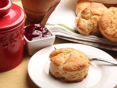 biscuits and jam are sitting on the table