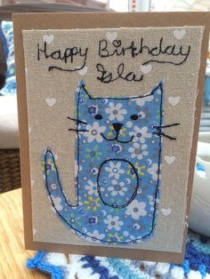 a birthday card with a blue cat on it