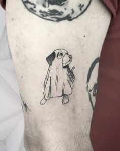 a man with a dog tattoo on his arm