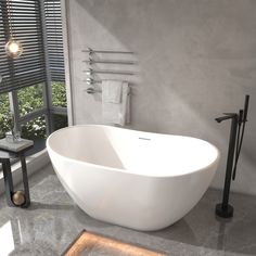 a large white bath tub sitting next to a window