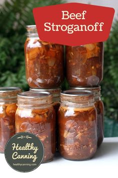 several jars filled with food sitting on top of a table