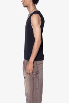 the Waffle Knit Tank is a 100% cotton tank is perfect as a base layer or worn alone. the tank features taping at the neck and arm openings, a flat hem, and is constructed in a ribbed material. details flat hem 100% ribbed cotton fabric Model is 6’0, 140 lbs and wears a size medium 140 Lbs, Nylon Pants, Knit Tank, Knit Tanks, Base Layer, Waffle Knit, Denim Wash, Short Tops, Black Pants