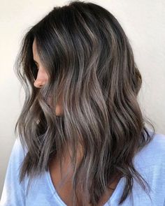 Keep things low maintenance with this shadow root look. It smudges the color seamlessly near the roots to avoid any awkward growing-out phase, and you get to reap the full-on ash benefits. #ashbrownhair #brunette #fallhaircolors #hairtrends #beauty #southernliving Frosty Brunette, Frosty Brunette Hair, Ash Gray Hair Color, Ash Brown Hair, Luxy Hair, Brunette Color, Winter Hair Color, Balayage Brunette