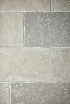 a white toilet sitting on top of a tiled floor