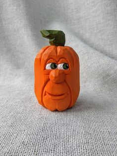 an orange pumpkin with a face on it