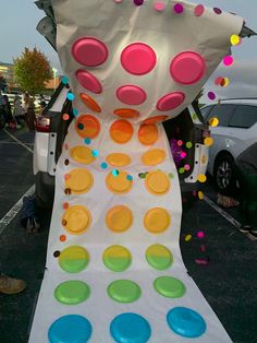 a white table topped with lots of plates and confetti on top of it