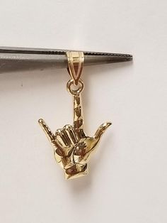 "Thanks for shopping our vintage estate store. We tend to sell well below wholesale and truly hope you enjoy all of our items. Many of the items are one of a kind, so please enjoy scrolling through the pictures and hopefully something will catch your eye. Spots are from camera or reflections. Beautiful estate 14k yellow gold Sign Language I Love You charm or pendant. Just love this. Length: 7/8\" Width: 5/8\" Weight: .95 gram  Bail: 2mm Nice gold pendant, marked 14k." Collectible 14k Gold Heart-shaped Jewelry, Collectible Gold Heart Pendant Jewelry, Gold Jewelry For Valentine's Day Collectible, I Love You Signs, 2024 Wishlist, Gold Sign, Sign Language, Gold Pendant, Heart Pendant