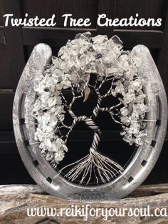 a glass tree with the words twisted three creations on it and an image of flowers