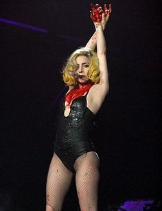 lady in black and red outfit performing on stage