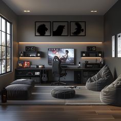 a living room filled with lots of furniture and a flat screen tv mounted to the wall