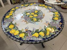 a table with yellow lemons painted on it