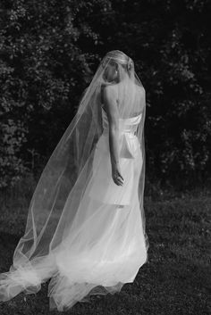 a woman in a wedding dress and veil