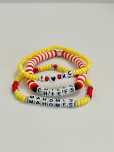 Show everyone that Patrick Mahomes is your favorite player on the KC Chiefs team by wearing these beaded bracelets.      Information about our bracelets:  -All letters are uppercase. -Made with: clay disc beads, silver plated disc beads, czech seed beads, acrylic letter beads. -Bracelets are made with sturdy quality jewelry elastic. -Made to order.  -Closure-tie. Care tips: -Do not expose jewelry to water.  -Treat and store jewelry gently.  -Roll bracelets on rather than stretching band to get on. It Band Stretches, Heishi Bracelets, Football Bracelet, Heishi Bracelet, Gifts For Football Fans, Patrick Mahomes, Sports Bracelet, Acrylic Letters, Store Jewelry