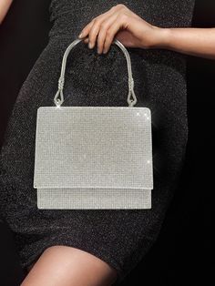 BagForLove - Party-ready Mini Square Bag with Glitter Flap and Rhinestone Detail Product Description Color Silver Details Rhinestone Magnetic Yes Strap Type Top Handle Bag Size Mini Pattern Type Plain Type Square Bag Closure Type Flap Material Glitter Composition 100% Polyester Size Chart INCH CM Bag Height Bag Length Bag Width Handle Height Strap Length 5.5 inch 6.3 inch 2.8 inch 4.3 inch 47.2 inch Bag Height Bag Length Bag Width Handle Height Strap Length 14 cm 16 cm 7 cm 11 cm 120 cm Details Pictures Similar Products h2 { text-align: center; } /* æ¢è¡ */ li{ white-space: normal; word-break: break-all; word-wrap: break-word; } .red-box { width: 100%; display: flex; flex-direction: row; flex-wrap: wrap; justify-content: center; } .red-box > div { width: 190px; height: 250px; margin: 10p Rhinestone Handheld Evening Bag For Party, Handheld Rhinestone Evening Bag For Party, Sparkling Crystal Bags For Party, Glamorous Rhinestone Clutch For Night Out, Evening Bags With Crystal Material, Glamorous Handheld Evening Bag With Rhinestones, Crystal Evening Bag With Bling For Party, Crystal Evening Bag With Rhinestones For Parties, Crystal Bling Evening Bag For Party