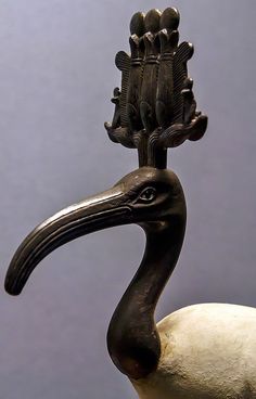 a sculpture of a bird with an elaborate head