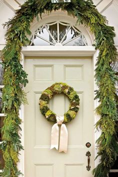 a wreath is hanging on the front door