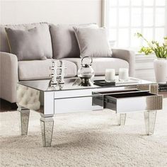 a living room with a couch, coffee table and vases on the carpeted floor