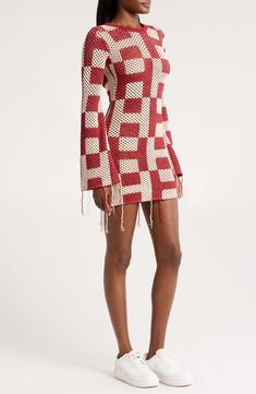 An openwork monogram pattern and dramatically fraying edges lend artisanal beauty to a boho bell-sleeve sweater-dress finished with a daring plunging back. 34" length, 4" fringe (size medium) Adjustable back tie closure Crewneck Long sleeves Unlined 60% cotton, 40% acrylic Dry clean Imported Black Owned/Founded Bohemian Long Sleeve Crochet Dress For Fall, Fitted Bohemian Crochet Dress With Long Sleeves, Fitted Long Sleeve Bohemian Crochet Dress, Fitted Crochet Dress With Fringe For Spring, Casual Mini Sweater Dress With Textured Knit, Winter Textured Knit Mini Sweater Dress, Spring Textured Knit Mini Sweater Dress, Textured Knit Mini Sweater Dress, Long Sleeve Pointelle Knit Sweater Dress