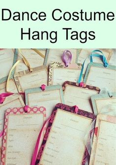 dance costume hang tags are lined up on top of each other with ribbons around them