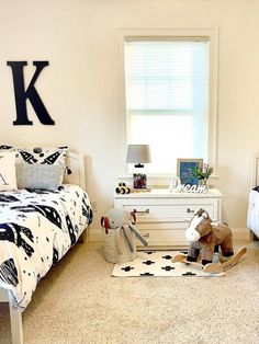 two children's bedroom with black and white decor