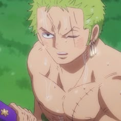 an anime character with green hair and piercings holding a purple object in his hand