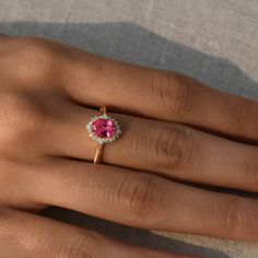 DetailsMaterial: 14k/18k gold Color Options: Yellow Gold, White Gold, Rose Gold, ★ Center StonePink Tourmaline, OvalSize: 5X7 mmApprox Weight (Ct): 0.96★ Accent StonesDiamond RoundSize: 1.1 mm * 12 No.s , 1.5 mm * 4 Nos.Approx Weight (Ct): 0.15★ Band Width: 1.3 mm★ Ring Height: 7 mm Pink Ruby Ring With Halo Design, Elegant Pink Tourmaline Birthstone Ring, Gift Pink Ruby Halo Ring, Gift Pink Halo Ruby Ring, Pink Ruby Halo Ring Perfect For Gift, Pink Ruby Ring With Halo For Gift, Pink 14k Gold Halo Ring, Pink Birthstone Ring With Gemstone For Formal Occasions, Classic Pink Gemstone Birthstone Ring