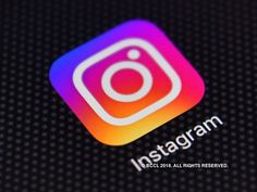 the instagram logo is displayed on an iphone