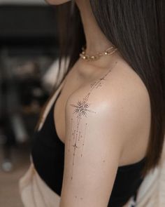 a woman with a star tattoo on her chest