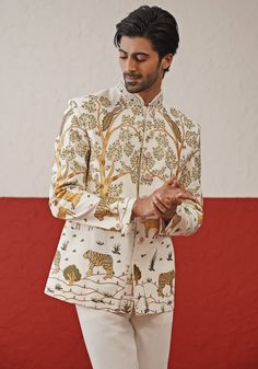 Step into sophistication with the Off White Jodhpuri suit. Crafted from georgette, the suit features a stunning multi-color resham and sequin work. The handwork on the collar and buttons adds an extra touch of elegance. Perfectly paired with matching pants. Perfect for special occasions like Sangeet, Mehendi, Haldi, or as a wedding guest outfit. Composition : Jodhpuri Jacket & Pant : Viscose Georgette Care: Dry Clean Only and Vacuum Storage This product can be customized for sleeves, length and colour Delivery : 4-6 weeks as the product is hand crafted. Check Size Guide or choose MySize for free customisation (All Sizes above XL can be made at 15% additional cost) For more information and sizes please contact fabiliciousfashion@gmail.com or visit our Copenhagen studio. About the Designer : Bollywood Style Fitted Suits With Resham Embroidery, Fitted Hand Embellished Kurta For Wedding, Formal Bollywood Hand Embellished Kurta, Fitted Hand Embellished Kurta For Eid, Traditional Hand Embellished Multicolor Sets, Festive Hand Embellished Multicolor Sets, Festive Multicolor Hand-embellished Sets, Festive Multicolor Hand Embellished Sets, Fitted Silk Sherwani With Dabka Work