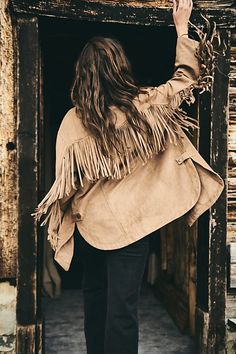 Go Western in this fringed-out vegan suede shirt jacket. **Fit:** Relaxed, oversized **Features:** Vegan suede fabrication, button-front closure, collared neckline, long button-cuff sleeves, fringe along chest, back, and sleeves, curved hem with side slits **Why We | Fringe Out Vegan Suede Jacket by Free People in Brown, Size: M Suede Fringe Jacket Outfit, Fringe Jacket Outfit, Western Womens Fashion, Fringe Fabric, Suede Fringe Jacket, Biker Jackets, Vintage Suede, Fringe Jacket, Suede Fringe