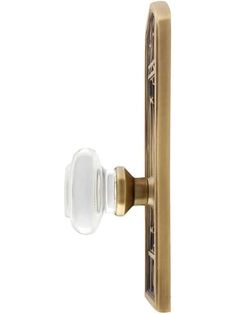 an antique brass door handle with glass knob