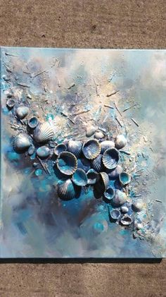 an abstract painting with seashells on it