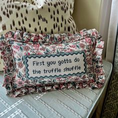 a pillow that is sitting on top of a chair next to a pillow with the words first you gota do the turtle shuffle