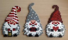 three christmas ornaments made out of perler beads