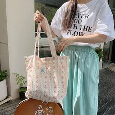 Material: Canvas Size: 44*34cm / 17.16"*13.26" Color: As shown in the picture 1. Canvas material: This bag is made of high-quality canvas material, which is lightweight, lasting, and reliable in quality. 2. Romantic floral print: The bag's floral print design is romantic and fresh, which perfectly matches the temperament of girls. 3. Large capacity: The bag's large capacity is spacious enough to hold books, laptops, and other items, making it an ideal companion for school or travel. Package incl Romantic Floral Print, Women Flower, Floral Print Design, Flower Canvas, Canvas Shoulder Bag, Canvas Material, Large Bags, Canvas Size, Floral Print