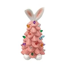 a pink ceramic christmas tree with bunny ears