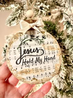 Hymn Ornaments. This listing is for a Jesus Hold My Hand Hymn ornament. These handmade wooden ornaments can be displayed on your tree or year-round on your tiered tray. They can also be used as a gift tag. They measure 3.5"-4" round.  "Jesus Hold My Hand" is a classic hymn sang in Christian Churches across the world. This makes a thoughtful gift for friends and loved ones. This ornament has the option of Print on Front Only, Front & Back, or Personalize it.  If you choose to personalize, make su Hymnal Page Crafts, Scripture Ornaments, Jesus Hold My Hand, Christian Gifts Diy, Hymnal Crafts, Jesus Tree, Sheet Music Ornaments, Hymnal Art, German Ornaments